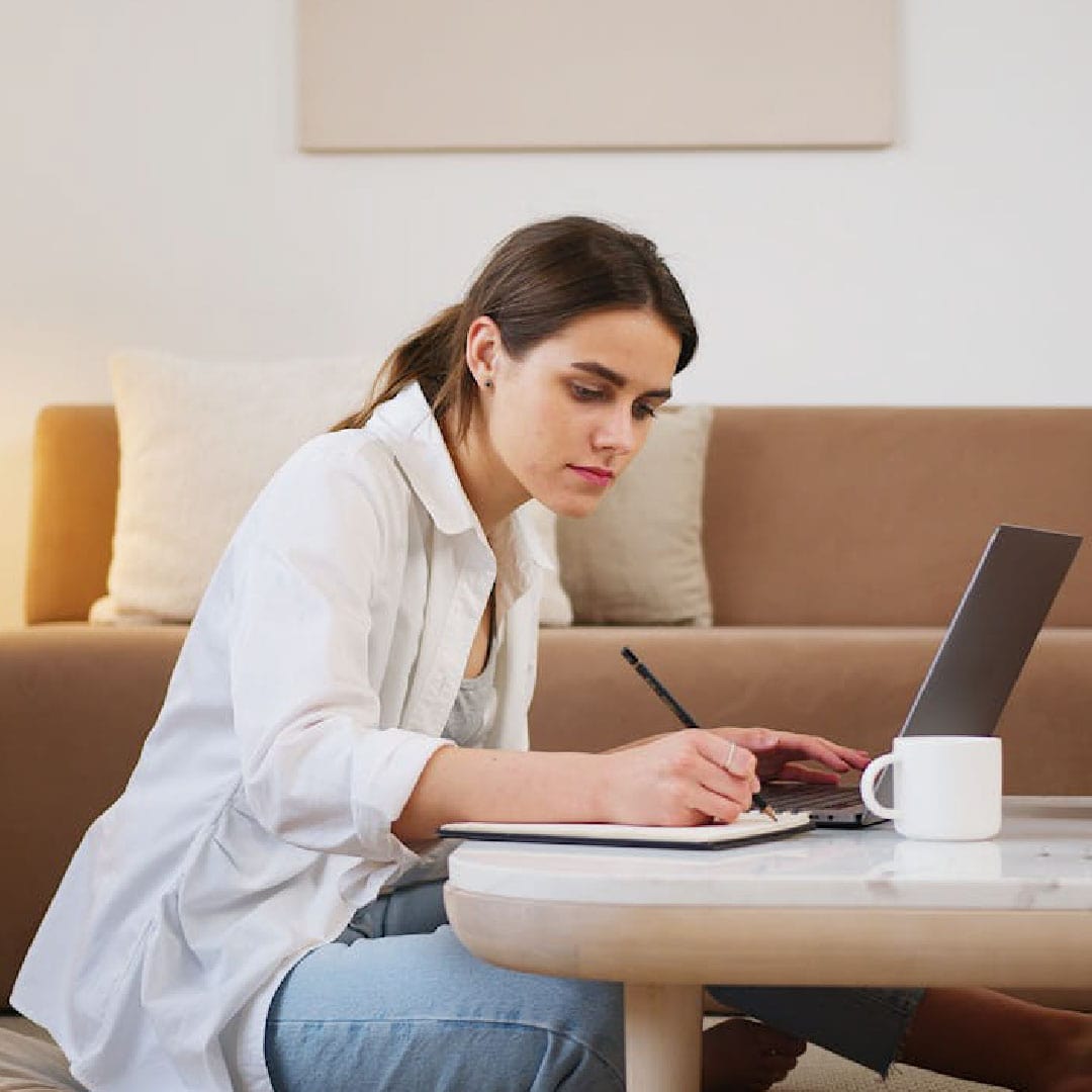 Woman working on a laptop for True Solutions website review project